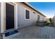 Backyard patio with built-in grill and access door at 640 S Olympic Dr, Gilbert, AZ 85296