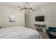 Spacious bedroom with a large TV and comfortable seating at 640 S Olympic Dr, Gilbert, AZ 85296