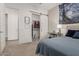 Bedroom with barn door closet and Starry Night wall art at 640 S Olympic Dr, Gilbert, AZ 85296