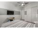 Spacious bedroom with ceiling fan and ample closet space at 640 S Olympic Dr, Gilbert, AZ 85296