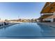 Inviting community pool with adjacent clubhouse at 640 S Olympic Dr, Gilbert, AZ 85296