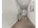 Spacious entryway with wood-look floors and accent wall at 640 S Olympic Dr, Gilbert, AZ 85296