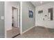 Modern entryway with wood-look flooring and a half-bath at 640 S Olympic Dr, Gilbert, AZ 85296