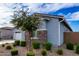 Side view of home showcasing stone accents and landscaping at 640 S Olympic Dr, Gilbert, AZ 85296