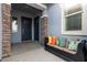 Covered porch with seating area and welcoming entryway at 640 S Olympic Dr, Gilbert, AZ 85296