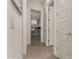 Clean and bright hallway with doors leading to bedrooms at 640 S Olympic Dr, Gilbert, AZ 85296