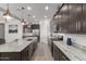 Open concept kitchen with ample counter space and island at 640 S Olympic Dr, Gilbert, AZ 85296
