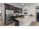 Modern kitchen with stainless steel appliances and granite countertops at 640 S Olympic Dr, Gilbert, AZ 85296