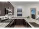 Modern kitchen with granite countertops and stainless steel appliances at 640 S Olympic Dr, Gilbert, AZ 85296