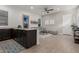 Open concept kitchen and living area with stylish furniture and wood-look floors at 640 S Olympic Dr, Gilbert, AZ 85296