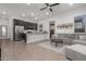 Open concept kitchen and living area with gray sectional sofa at 640 S Olympic Dr, Gilbert, AZ 85296