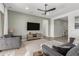 Bright living room features a large TV and comfortable seating at 640 S Olympic Dr, Gilbert, AZ 85296