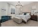 Spacious main bedroom with large bed and sitting area at 640 S Olympic Dr, Gilbert, AZ 85296