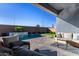 Covered patio overlooking a refreshing pool and waterfall feature at 640 S Olympic Dr, Gilbert, AZ 85296