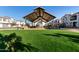 Covered playground with play structures for children at 640 S Olympic Dr, Gilbert, AZ 85296
