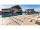 Community pool with lounge chairs and covered seating area at 640 S Olympic Dr, Gilbert, AZ 85296