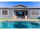Stunning pool view adjacent to a covered patio at 640 S Olympic Dr, Gilbert, AZ 85296