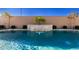 Tranquil waterfall feature in a modern backyard pool at 640 S Olympic Dr, Gilbert, AZ 85296