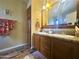 Double vanity bathroom with a large mirror and shower at 650 N Hawes Rd # 3702, Mesa, AZ 85207