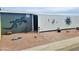 Decorative exterior wall with metal gecko art at 650 N Hawes Rd # 3702, Mesa, AZ 85207