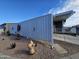 The home's exterior features a unique gate and landscaping at 650 N Hawes Rd # 3702, Mesa, AZ 85207