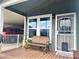 Inviting front entrance with a bench and pet door at 650 N Hawes Rd # 3702, Mesa, AZ 85207