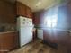 Efficient kitchen with wood cabinets and white appliances at 650 N Hawes Rd # 3702, Mesa, AZ 85207