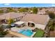 Luxury backyard oasis with a pool, spa, outdoor kitchen, and putting green at 6697 S Banning St, Gilbert, AZ 85298