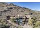 Luxury estate home on mountainside; private setting with pool and landscaping at 7150 N 64Th Pl, Paradise Valley, AZ 85253