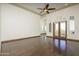 Spacious bedroom with hardwood floors and access to a private balcony at 7150 N 64Th Pl, Paradise Valley, AZ 85253