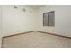 Bright and airy bedroom with neutral carpeting and wood trim at 7150 N 64Th Pl, Paradise Valley, AZ 85253