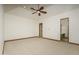 Spacious bedroom featuring ceiling fan and ample closet space at 7150 N 64Th Pl, Paradise Valley, AZ 85253