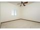 Bright bedroom with plantation shutters and neutral carpeting at 7150 N 64Th Pl, Paradise Valley, AZ 85253
