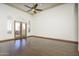 Spacious bedroom with hardwood floors and French doors leading to patio at 7150 N 64Th Pl, Paradise Valley, AZ 85253