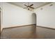 Large bedroom with hardwood floors and ceiling fan at 7150 N 64Th Pl, Paradise Valley, AZ 85253