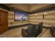 Dedicated home theater with comfortable seating and large screen at 7150 N 64Th Pl, Paradise Valley, AZ 85253