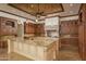 Spacious kitchen with large island and rich wood cabinets at 7150 N 64Th Pl, Paradise Valley, AZ 85253