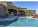 Resort-style pool with spa and expansive patio; outdoor kitchen at 7150 N 64Th Pl, Paradise Valley, AZ 85253