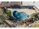 Freeform pool and spa with surrounding landscaping at 7150 N 64Th Pl, Paradise Valley, AZ 85253