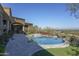Luxury pool and spa with outdoor kitchen and mountain views at 7150 N 64Th Pl, Paradise Valley, AZ 85253