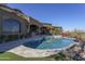 Luxury pool with spa and expansive patio; outdoor kitchen and mountain views at 7150 N 64Th Pl, Paradise Valley, AZ 85253