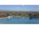 Stunning infinity pool overlooks a panoramic mountain and city vista at 7150 N 64Th Pl, Paradise Valley, AZ 85253