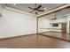 Home studio or exercise room with mirrored wall and hardwood floors at 7150 N 64Th Pl, Paradise Valley, AZ 85253