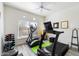 Well-equipped home gym featuring treadmill, elliptical, and weights at 8880 E Paraiso Dr # 108, Scottsdale, AZ 85255