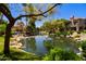 Serene community pond with lush landscaping and a tranquil setting at 10017 E Mountain View Rd # 1087, Scottsdale, AZ 85258