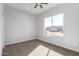 Spacious bedroom with large window and ceiling fan at 10176 W Heather Dr, Arizona City, AZ 85123