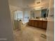 Clean bathroom with double vanity and soaking tub at 10617 W La Reata Ave, Avondale, AZ 85392