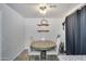 A simple dining room with a wood table and four white chairs at 10640 E Bogart Ave, Mesa, AZ 85208