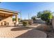 Landscaped backyard with patio and desert plants at 1113 W Fir Tree Rd, Queen Creek, AZ 85140