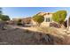 A gravel pathway winds through the backyard landscaping to a covered patio at 1113 W Fir Tree Rd, Queen Creek, AZ 85140